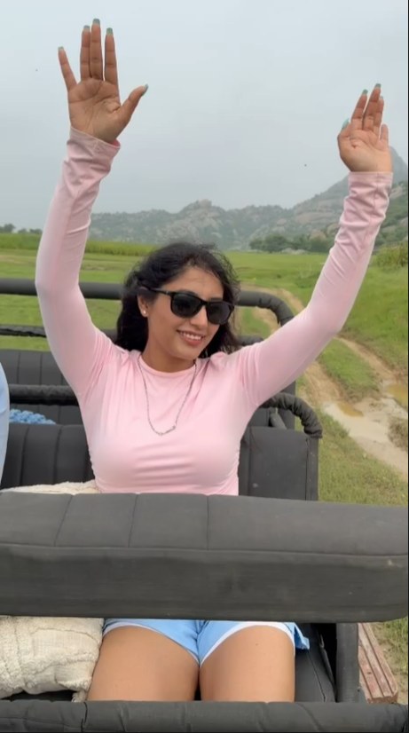 Guest celebrating from an open safari jeep in Jawai