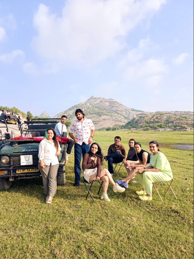 Guests gathered around the safari gypsy on green ground