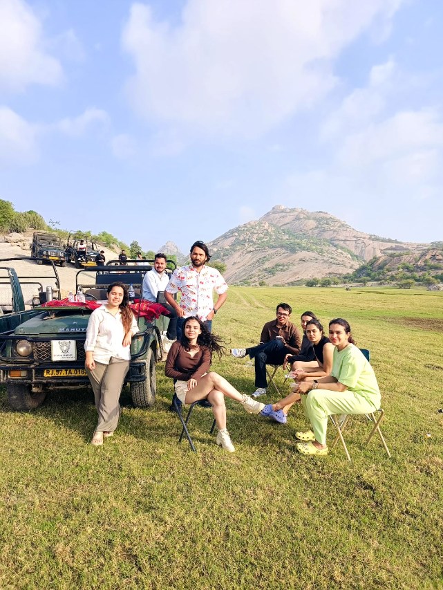 Safari guests enjoying the open landscape by their gypsy